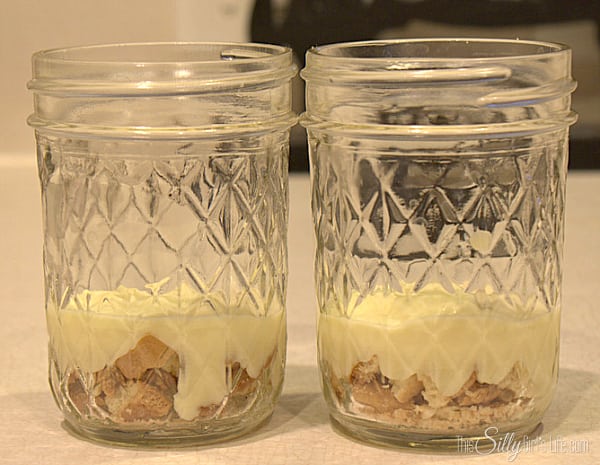 Make pudding according to directions on the back of the box. In a bowl, place half of the pudding and half of the whipped topping. Fold together until combined. In medium sized mason jar, layer the vanilla wafer crumbs and the banana pudding. 