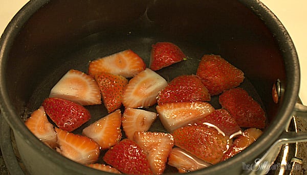Make the strawberry syrup first by placing all the ingredients in a sauce pot over medium heat. 