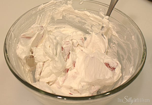 add in the whipped topping and vanilla, mix to combine. 