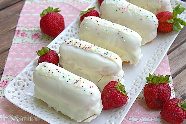 On a wired rack, using a spoon ladle the melted candiquick over each shortcake then place on a sheet tray that is covered in parchment paper or a silicone mat. Top with sprinkles if desired. Let candiquick set about 10 minutes or place in the refrigerator to set up faster. Serve and enjoy!